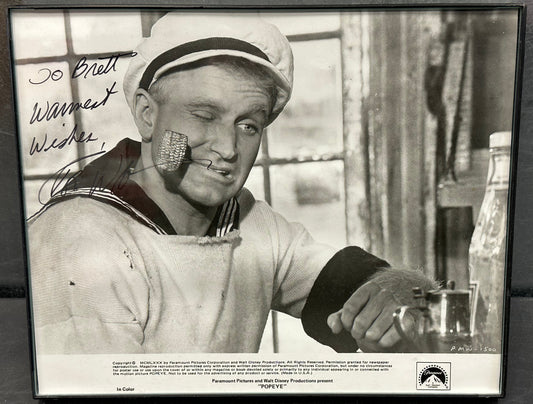 10x8 Framed 1980 Paramount Pictures and Walt Disney Productions "Popeye The Saylor Man" signed by Robert Williams